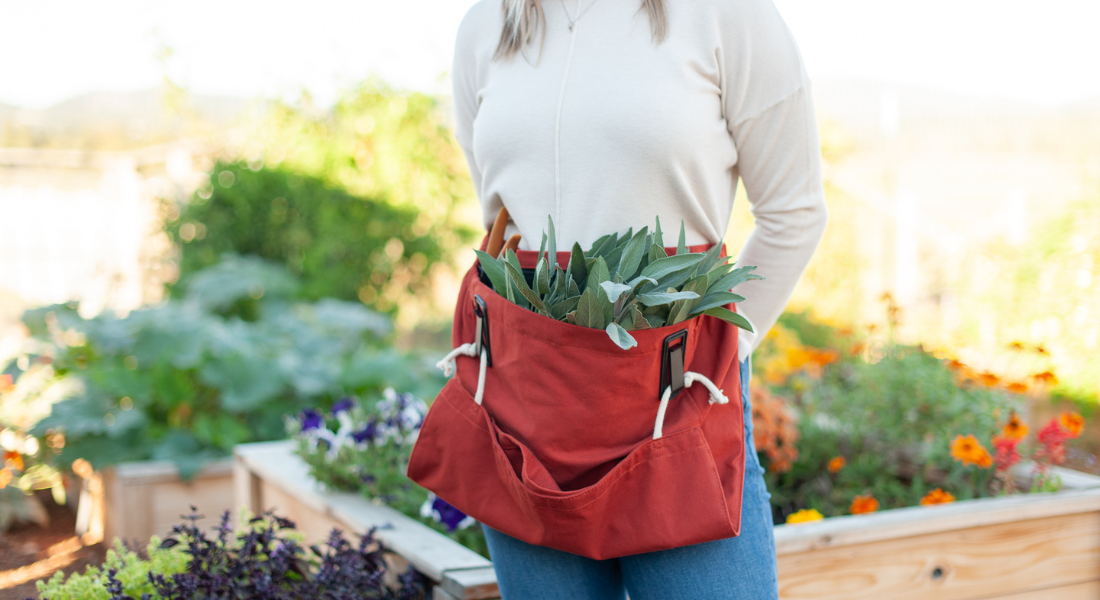 standing in garden with garden apron
