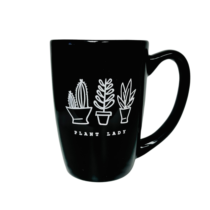 black and white coffee mug with plants